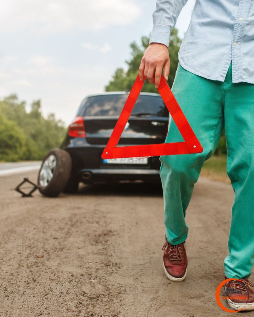 pojazd z uszkodzoną oponą